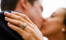 Kiss of Bride and Groom with Wedding Ring